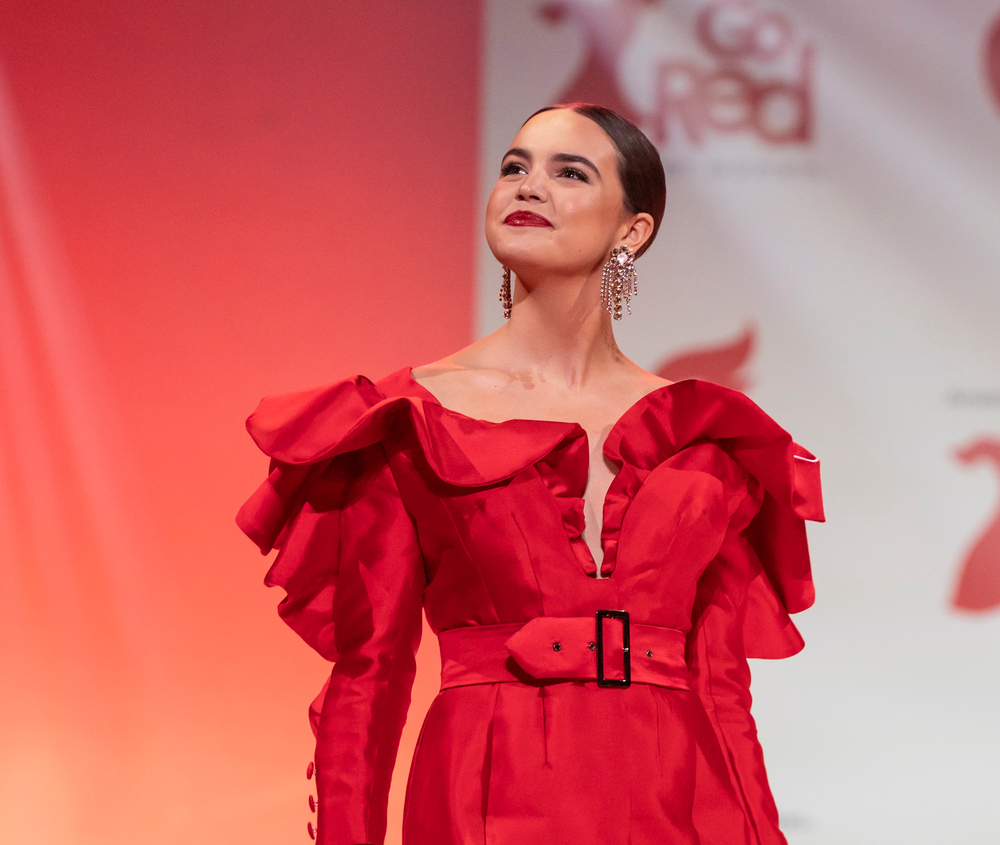 Bailee Madison wearing dress by Michael Fausto walks runway for The American Heart Association's Go Red For Women Red Dress Collection 2020